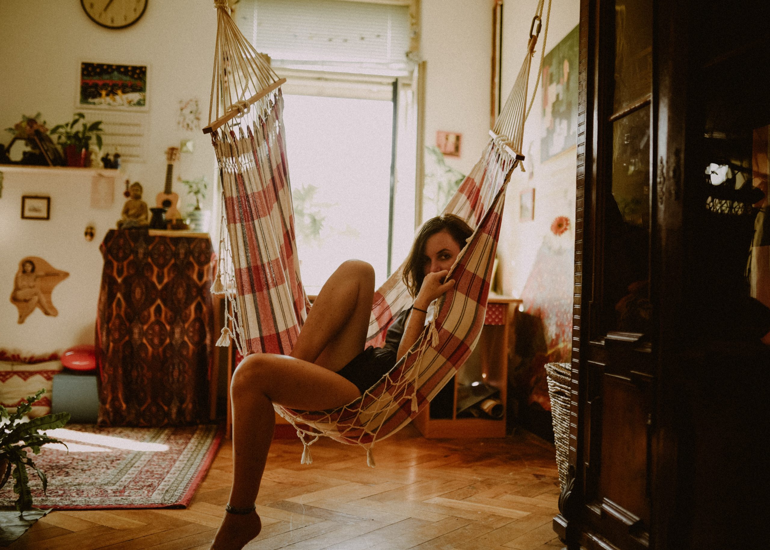 a uniquely decorated room with a hammock