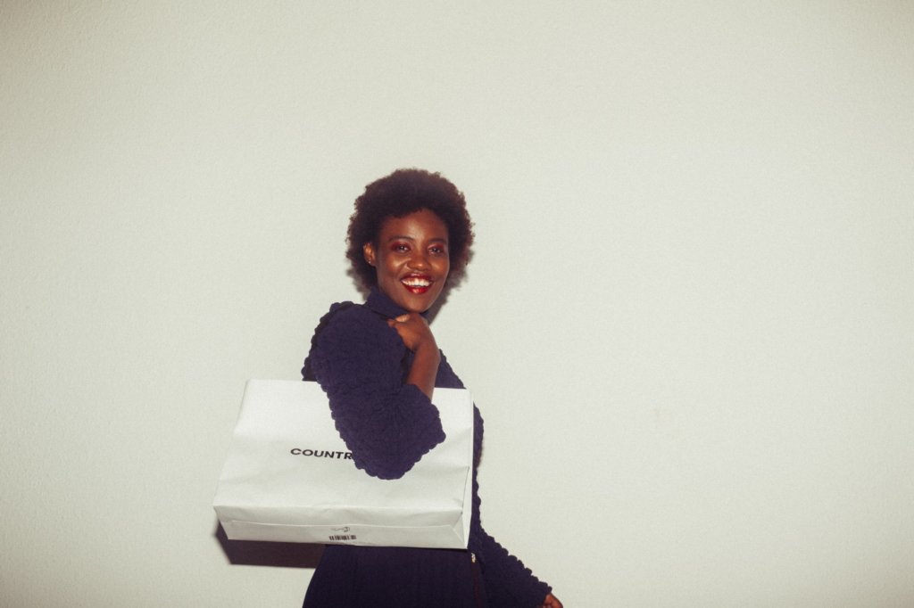 happy woman shopping with paper bag