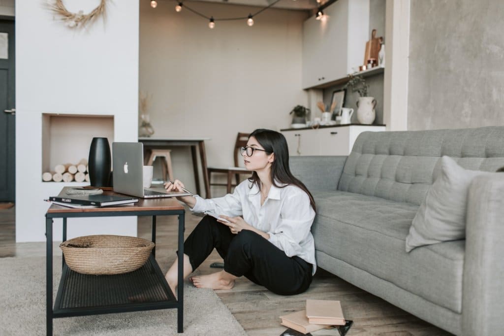 A woman shops online, displaying new consumer behaviors. 