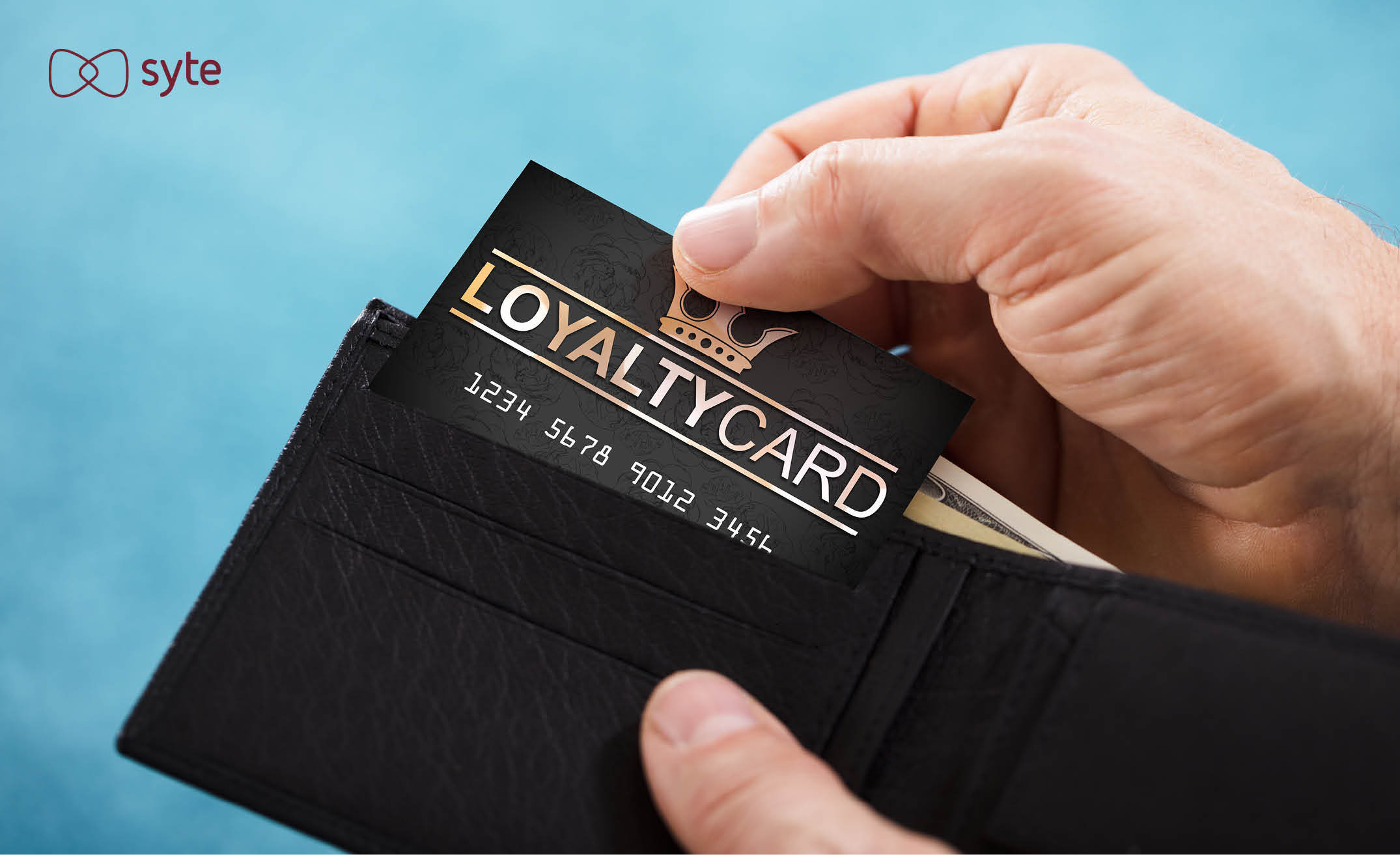 A man takes his loyalty card out of his wallet to make a Black Friday purchase