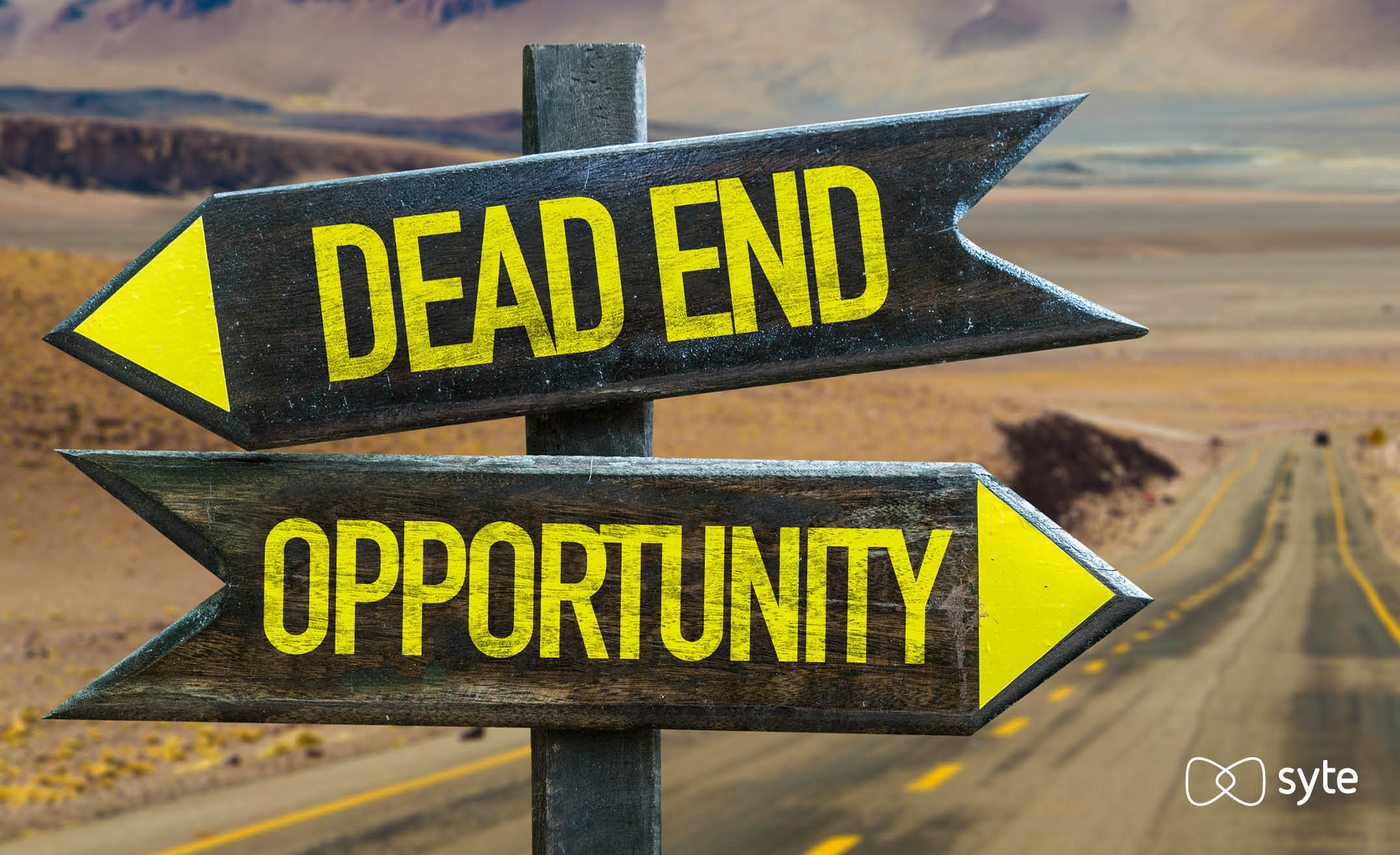 Two signs, one that says "dead end" and one that says "opportunity"