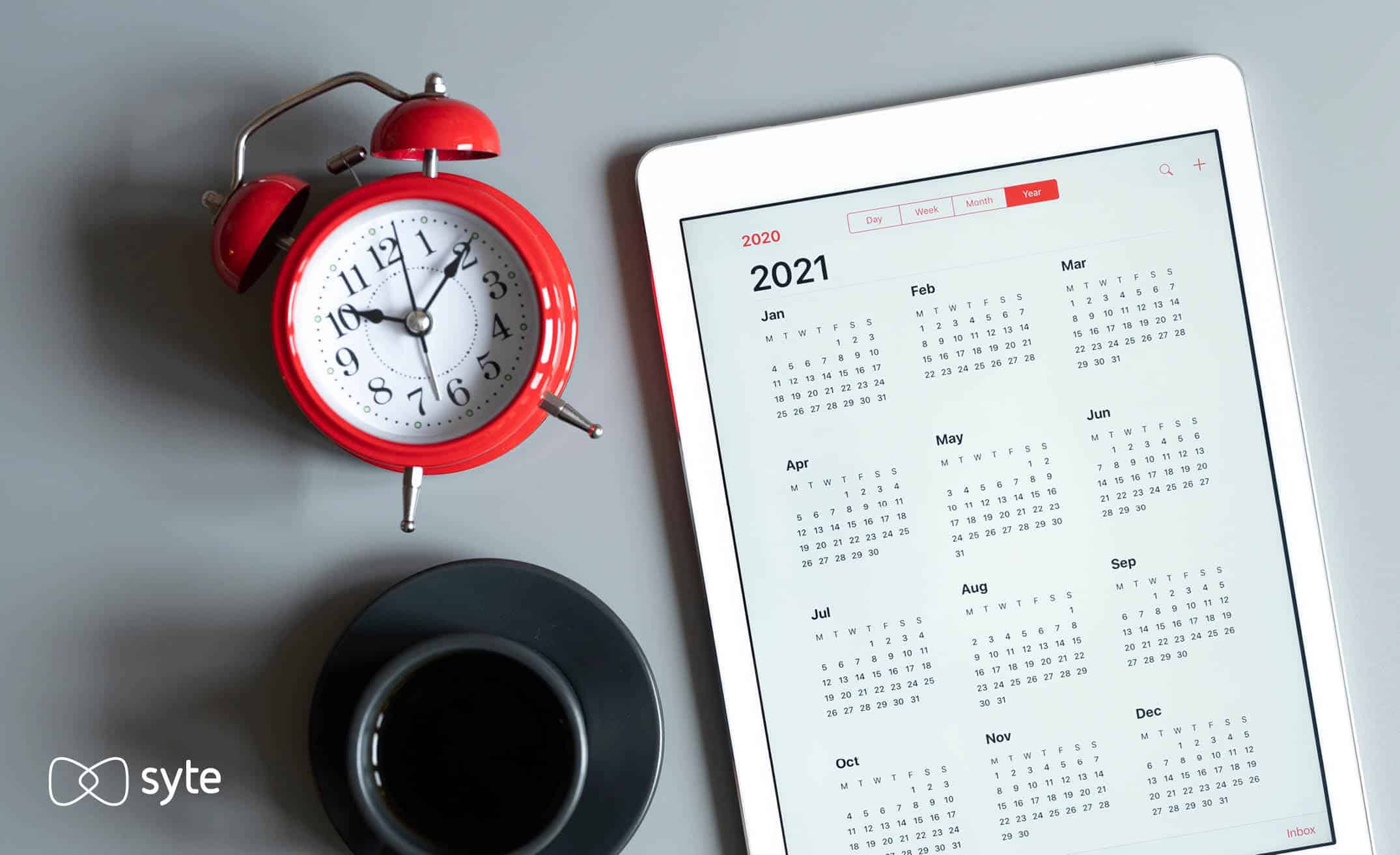 Calendar with alarm clock showing countdown to Black Friday