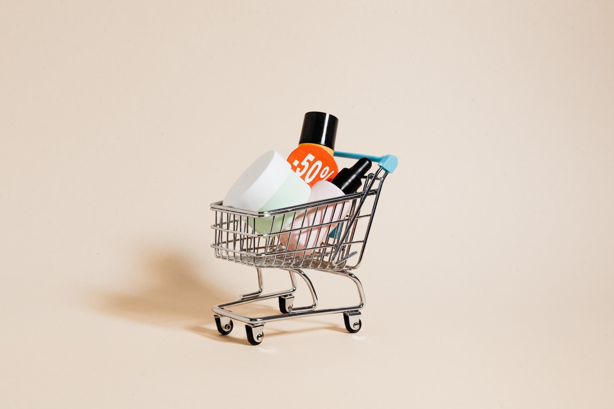 Cosmetic bottles in a tiny shopping cart