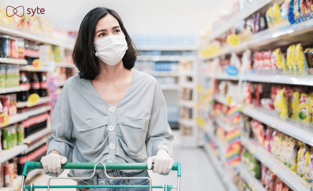 Female in grocery store shopping after taking advantage of hot new retail innovation trend for best time to shop apps. 