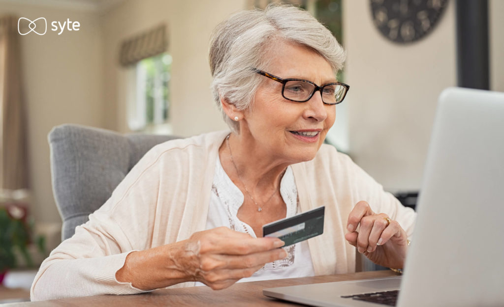 An older woman shops online. 