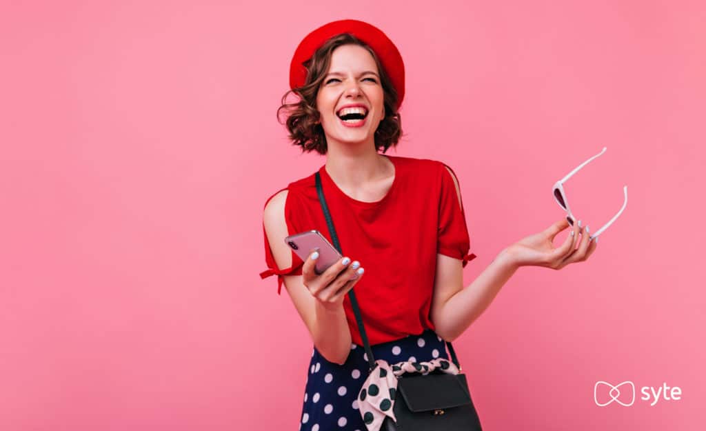 Excited woman shopping on her phone