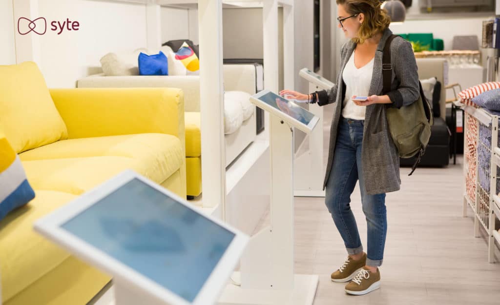 A shopper uses a digital display at a home decor store.