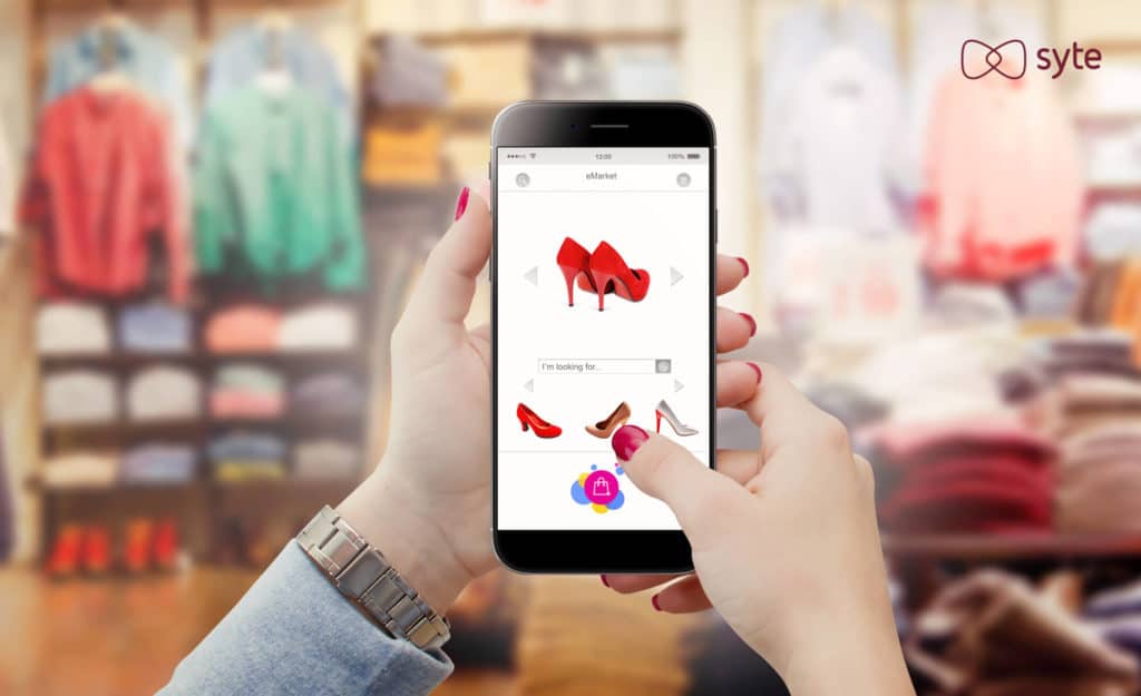 A woman uses a phone to purchase shoes in a retail store. 