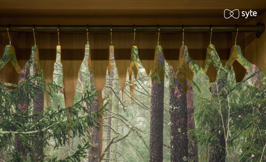 Trees hanging in a closet, illustrating the importance of sustainability in the future of shopping