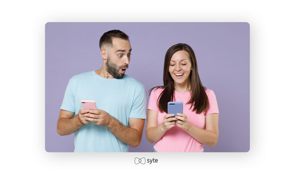 Woman showing a man a great deal on her phone