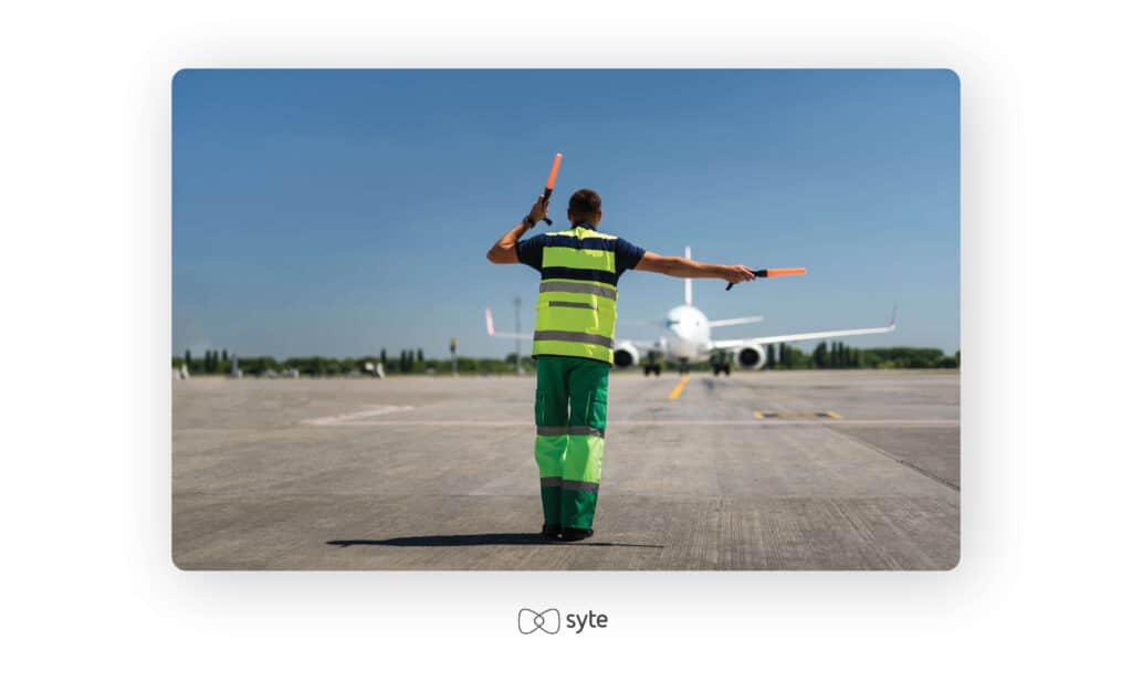 An aircraft marshall on the runway.