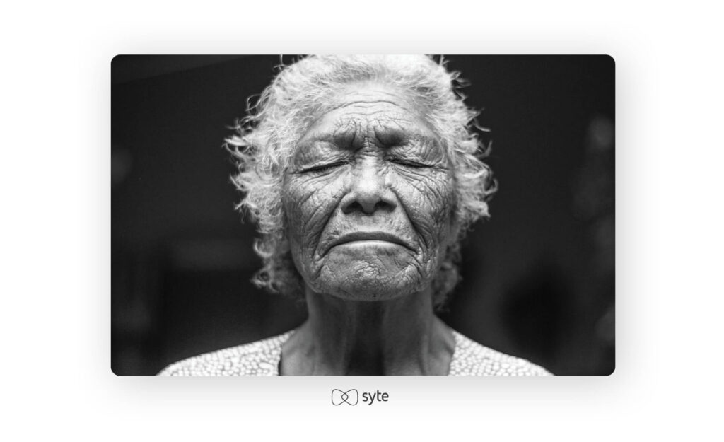 Black and white photo of an older woman.